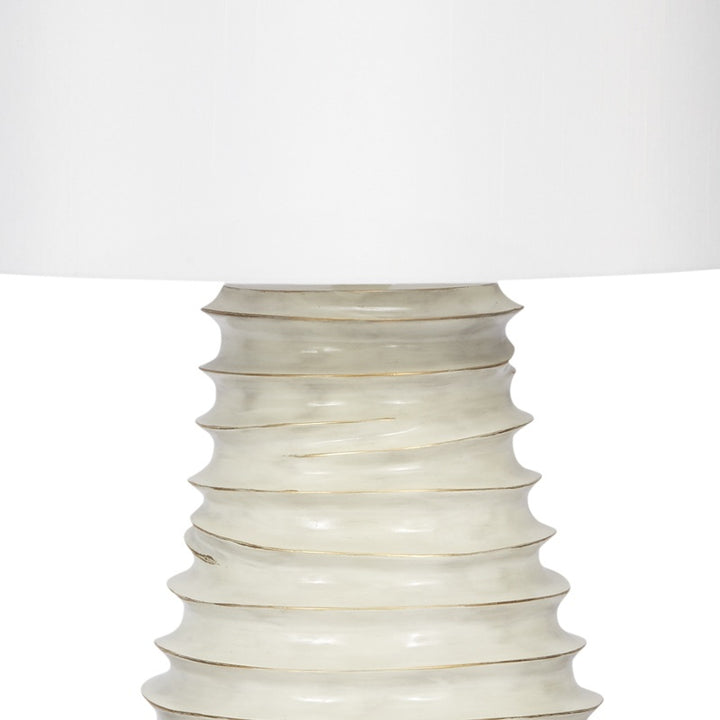 Cream ceramic lamp base with gold-washed ridges and white fabric shade