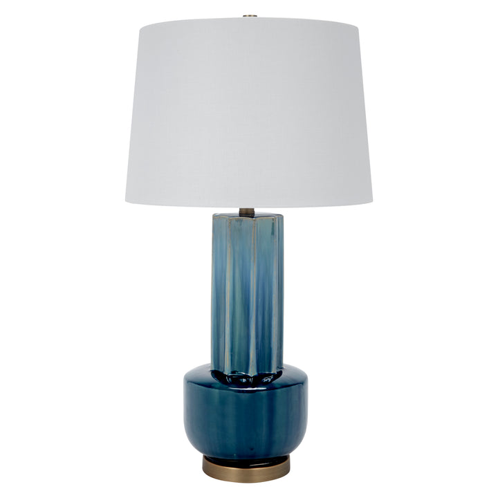 Blue-green ceramic table lamp with white drum shade and brass base