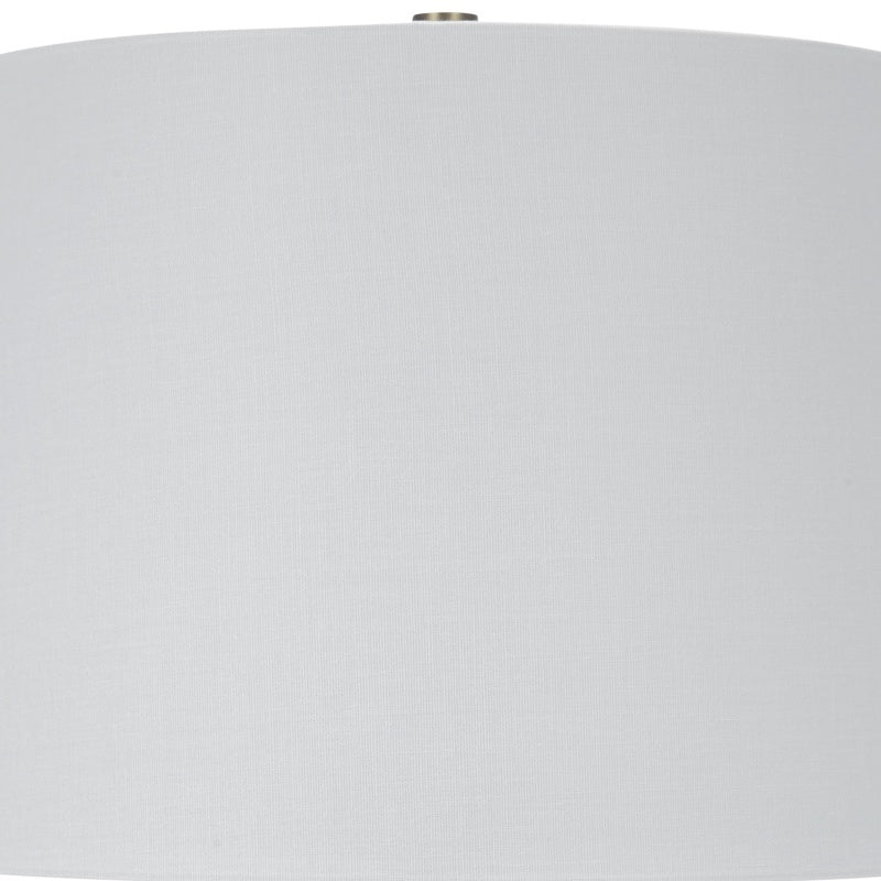 White drum lamp shade with finial on top of blue-green ceramic base