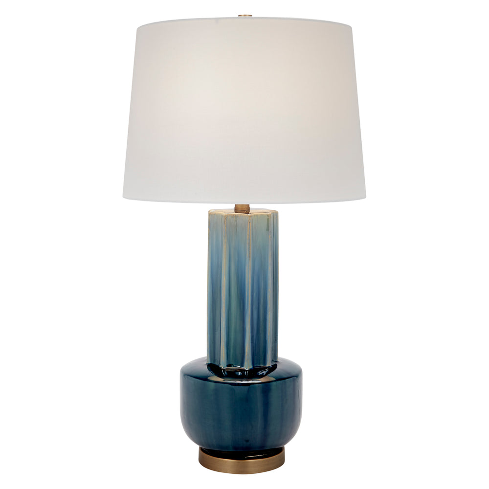Blue-green ceramic table lamp with white drum shade and brass base, full view