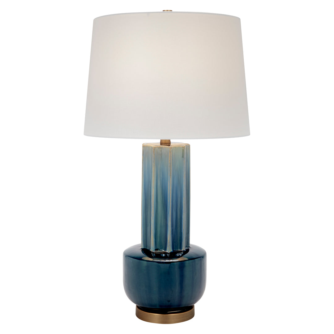 Blue-green ceramic table lamp with white drum shade and brass base, full view