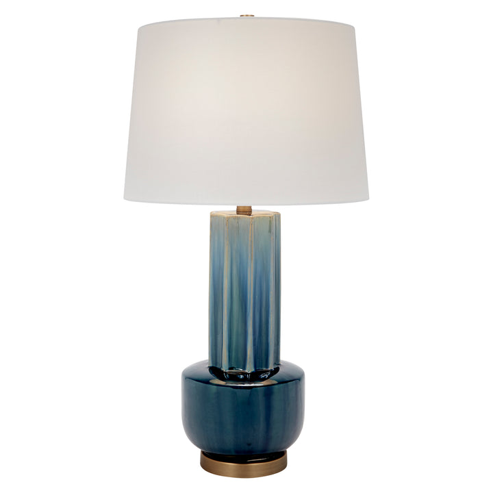 Blue-green ceramic table lamp with white drum shade and brass base, full view