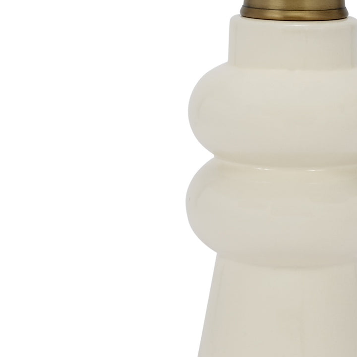 Cream ceramic lamp base with brass neck cap, rounded stacked profile