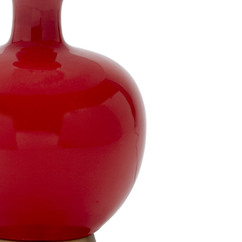 Red glossy ceramic table lamp body, rounded profile close-up