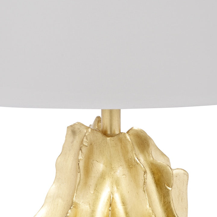 Gold leaf lamp base with vertical ridges under the white drum shade