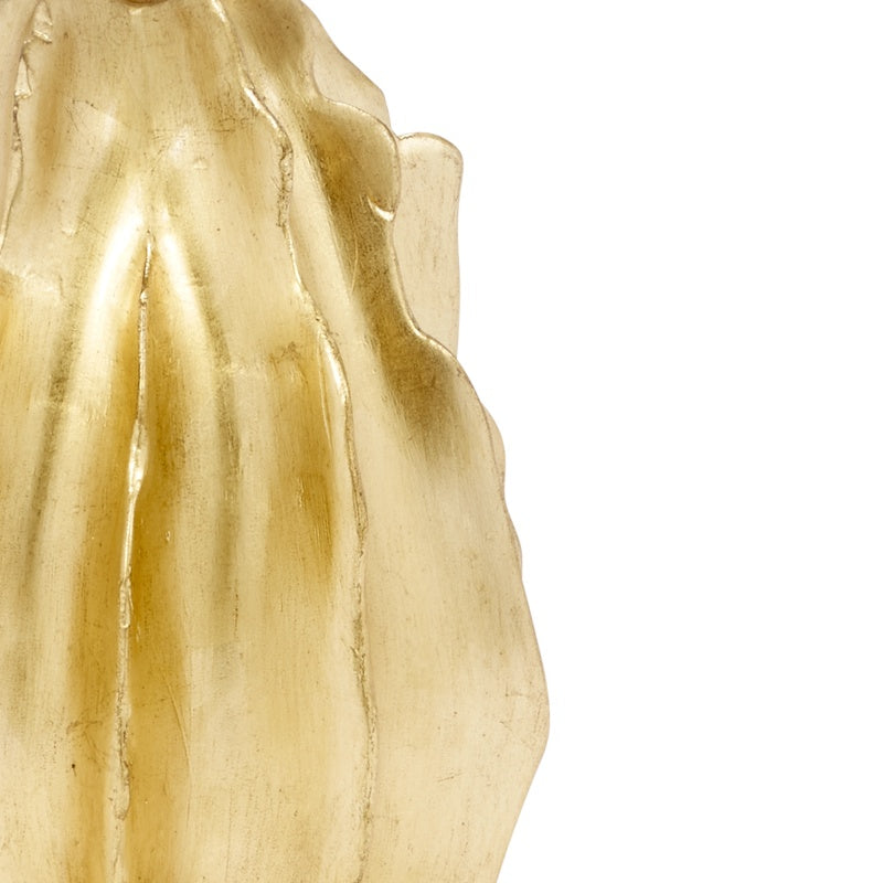 Close-up detail of gold leaf lamp base with sculpted ridge contours