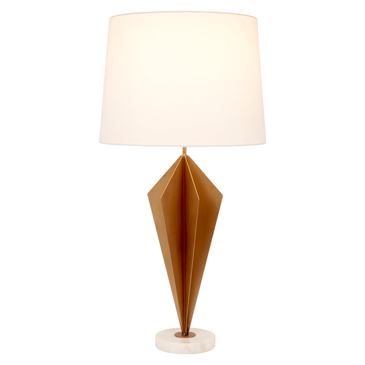 Gold faceted metal table lamp with white fabric shade and white round marble base