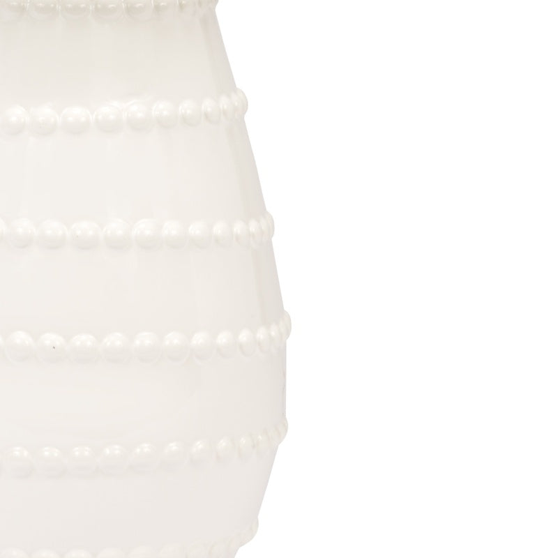 Close-up of white ceramic lamp base with pearl-like bead rows