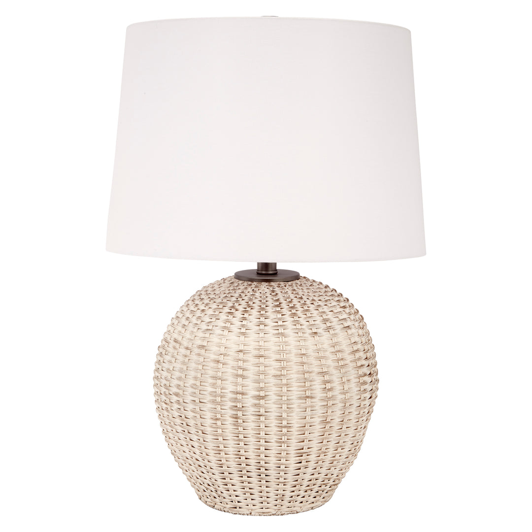 Table lamp with white linen drum shade and white-washed woven rattan base