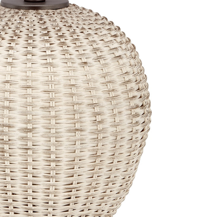 Woven rattan table lamp body with dense basket weave and dark top cap