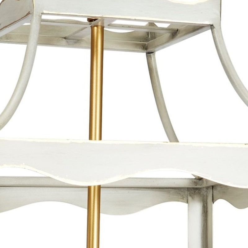Cream metal lantern frame with gold center post and tiered top detail