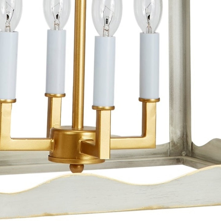 Gold and silver metal lantern with four clear bulbs and white candle sleeves