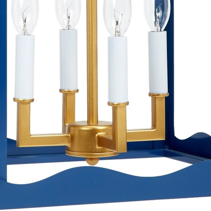 Gold base and navy blue four-light metal lantern with clear glass bulbs and sockets