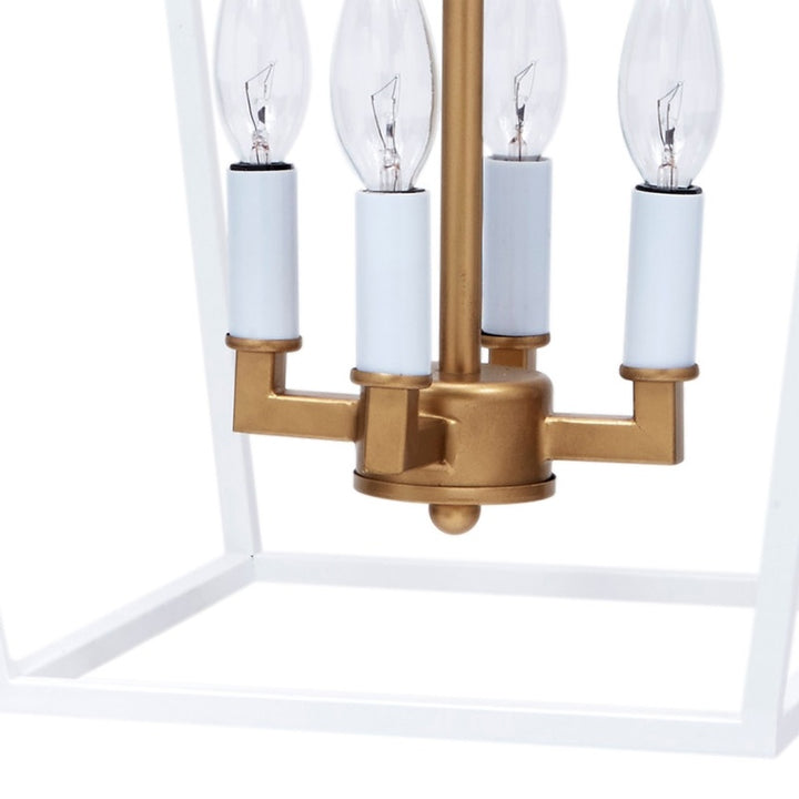 Four-light metal lantern with white cylindrical shades and gold base, clear bulbs