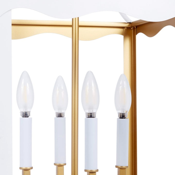 White metal four-light lantern with gold posts and four frosted bulb covers