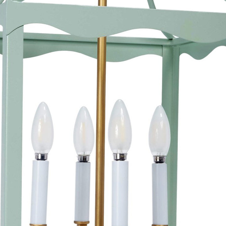 Light blue-green metal lantern with four white candelabra bulbs and gold center pole