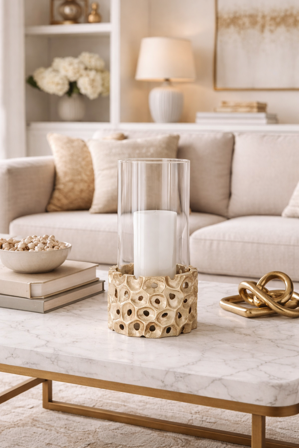 Living room with a marble coffee table, decorative vase, and books.