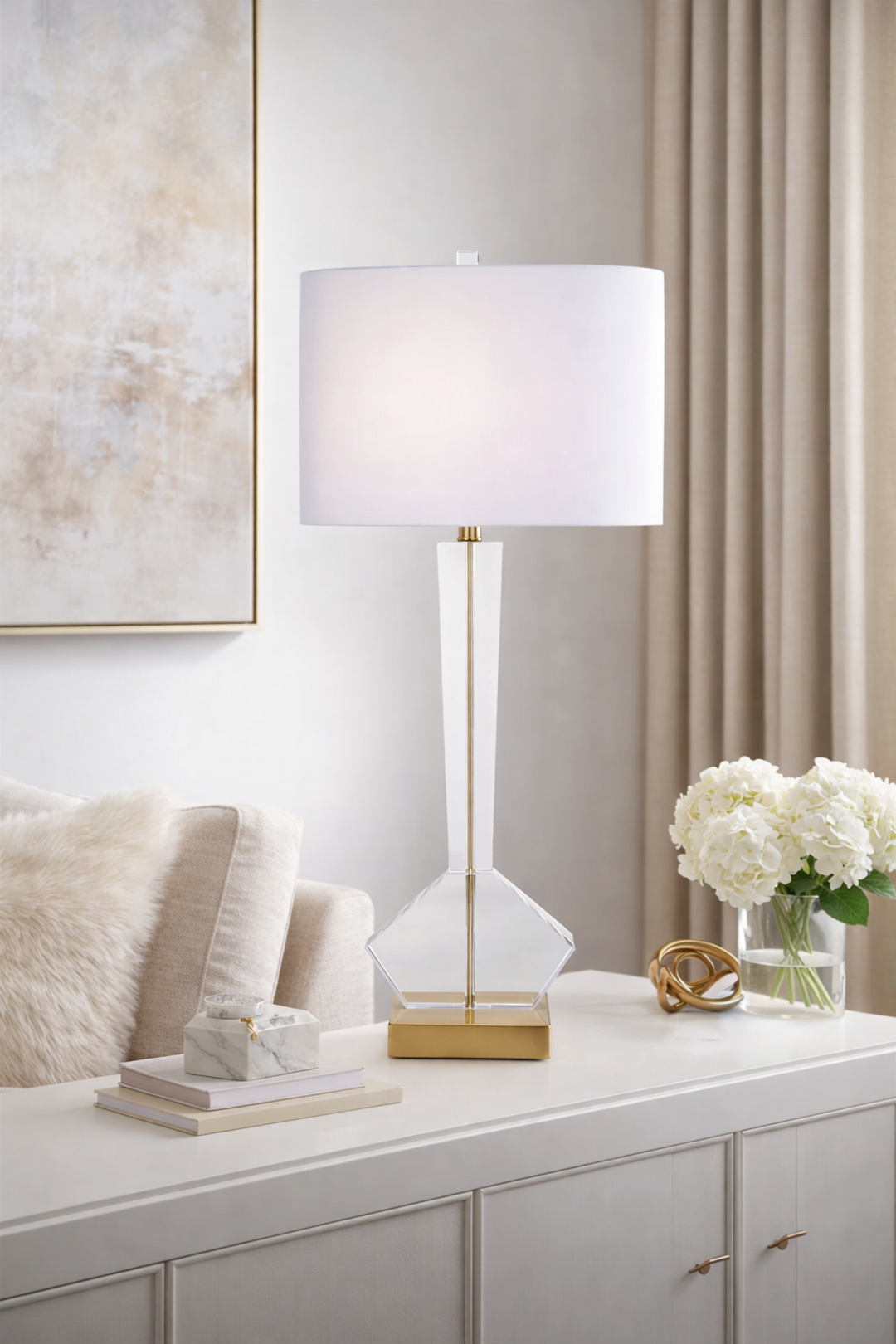 Table lamp on a console table with decorative items in a room setting.