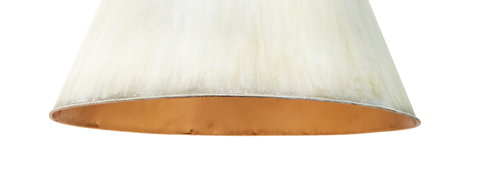 Close-up of a metal pendant with a brushed cream exterior and a gold interior, shown against a plain white background.