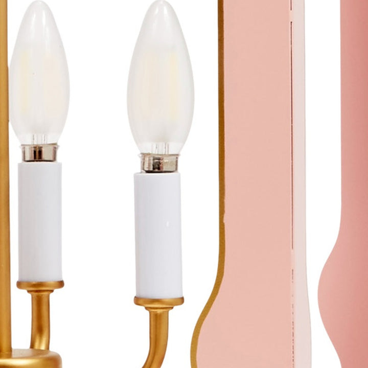 Pink pendant light frame with two white bulbs and gold base accents