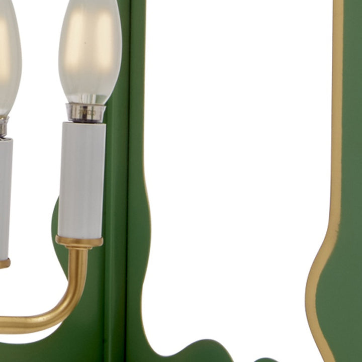 Four-light pendant light detail: gold scroll arm with clear candelabra bulb