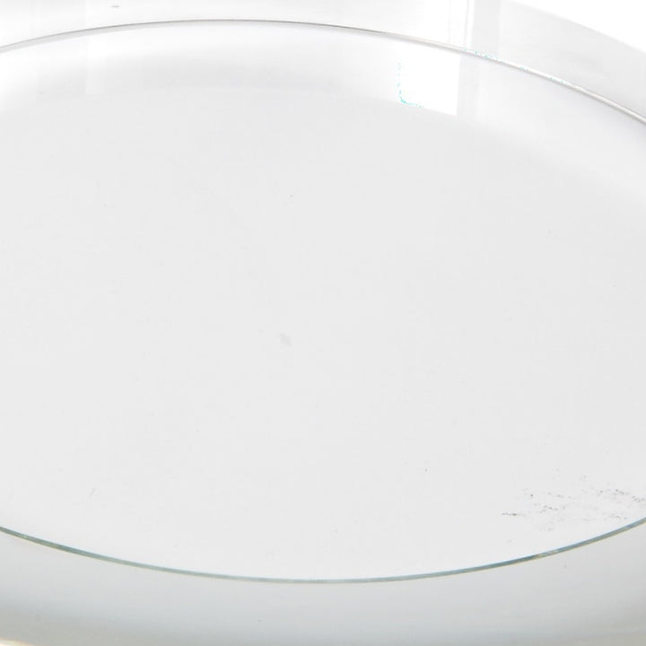 Clear round crystal riser, top view of smooth circular surface and rim