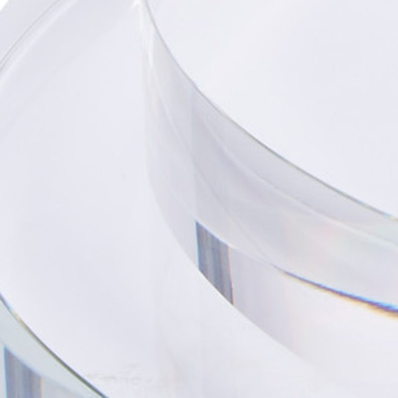 Large round clear crystal riser, close-up of curved rim and side