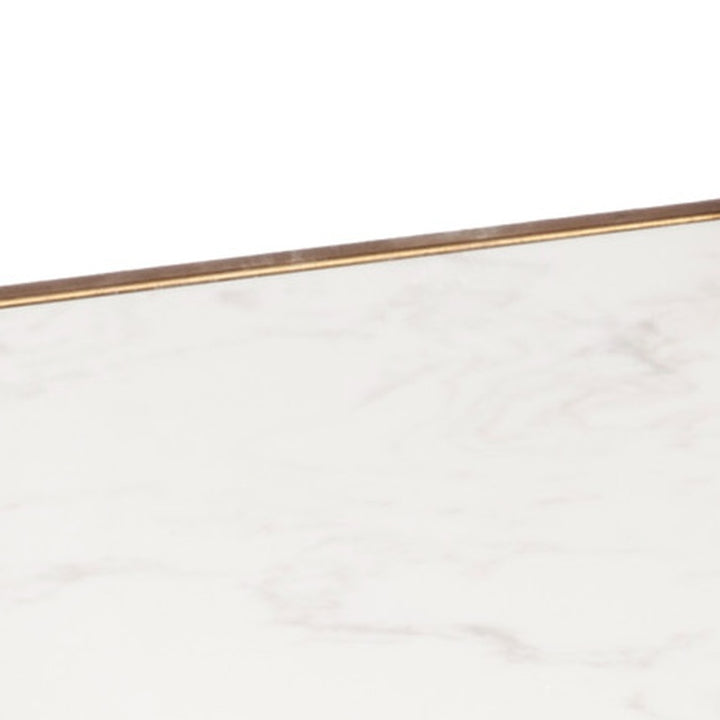 White marble tabletop with gold metal edge detail