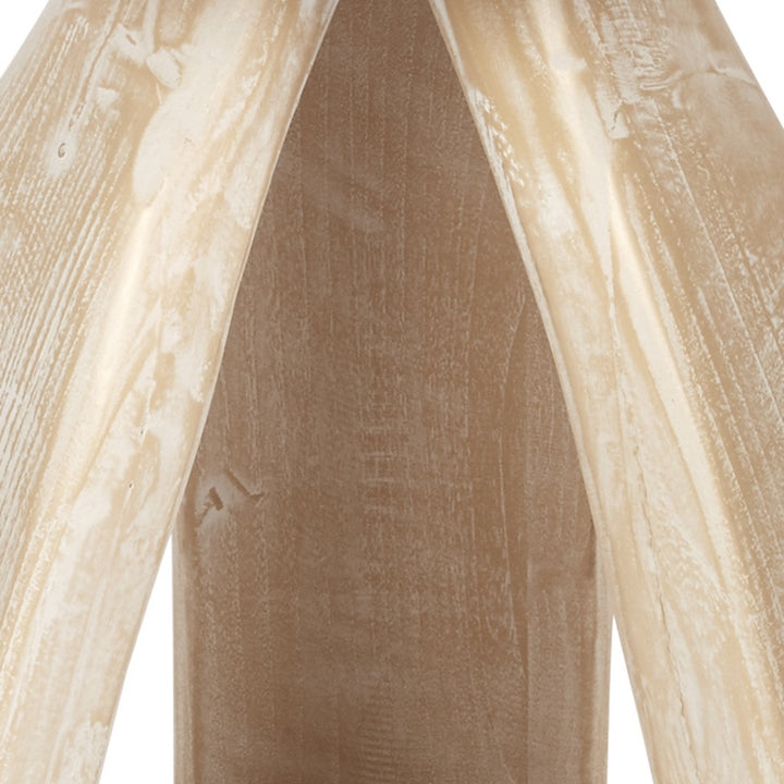 Close-up of brown interior panel and light distressed wood legs of accent table