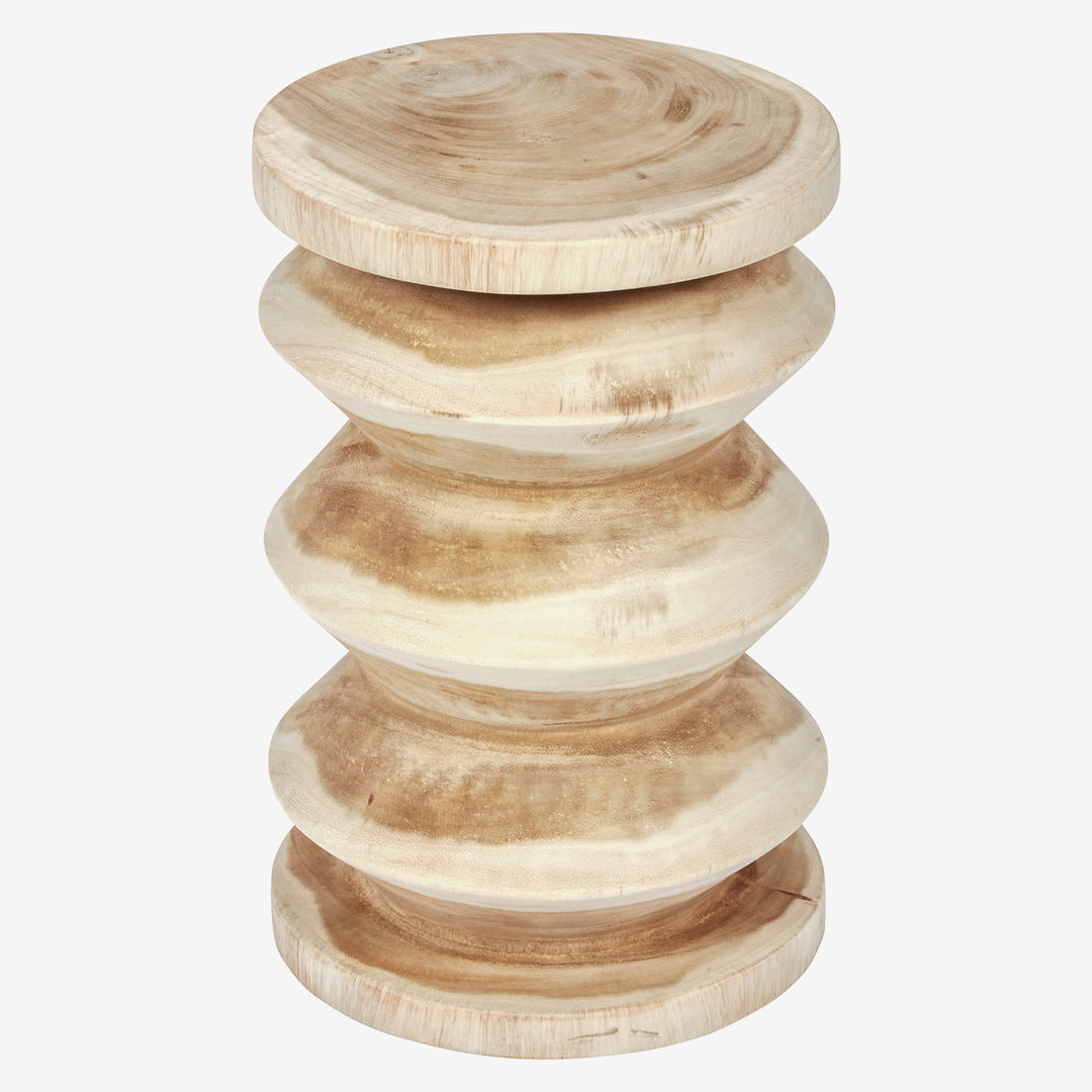A natural unfinished mungar wood accent table with a stacked, rounded, carved design and a smooth top surface.