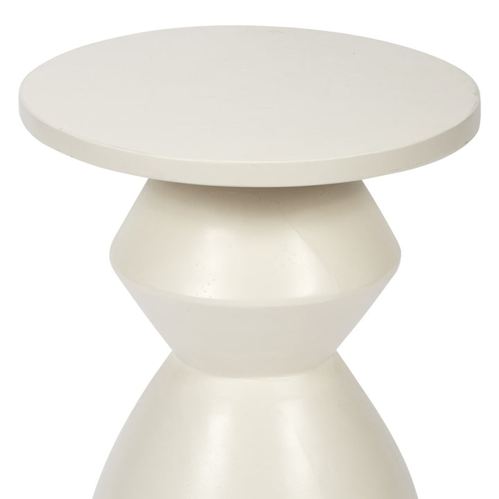 Round white accent table with pedestal base and tapered legs