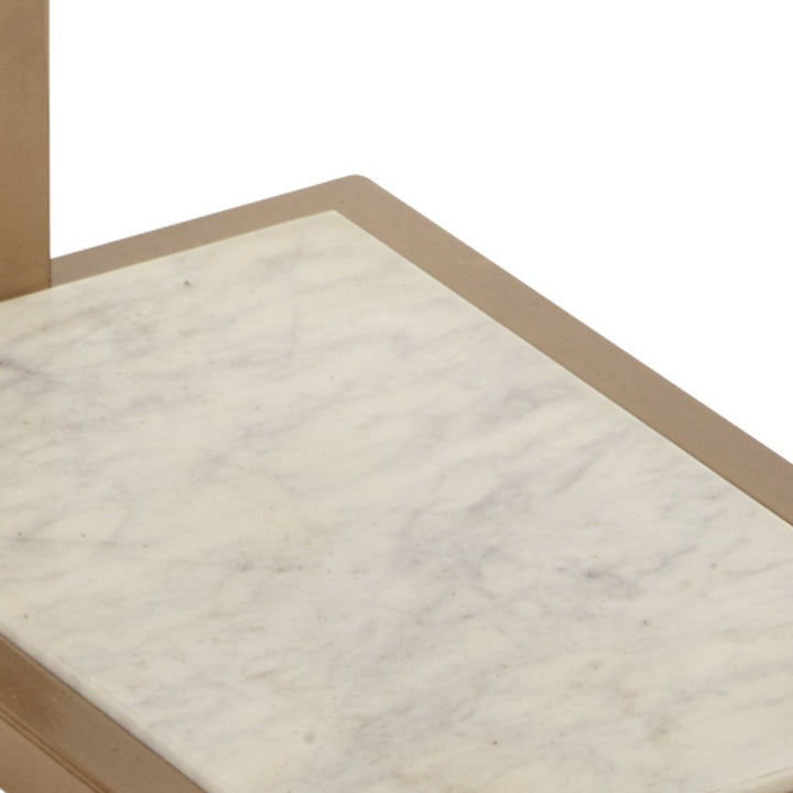 White marble tray top with gold border on small martini table, close-up