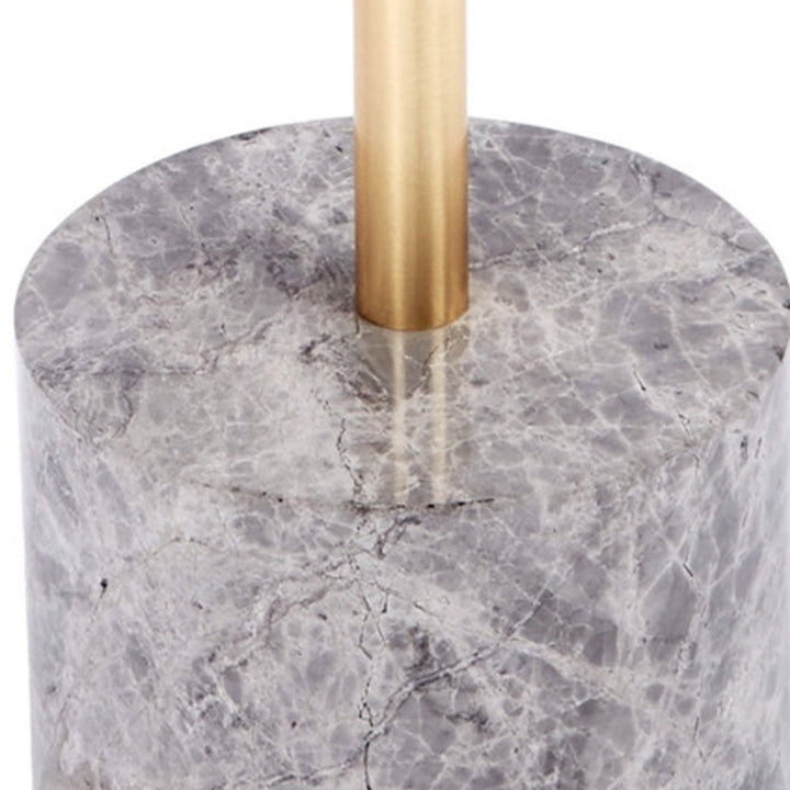 Grey marble round tabletop with gold metal column leg and veining