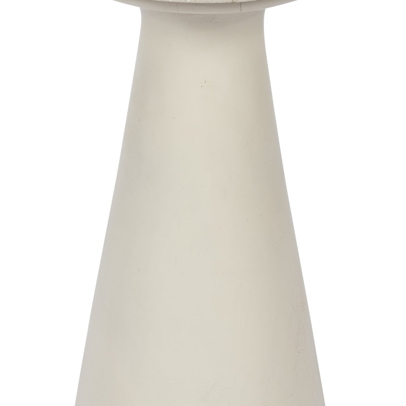 White pedestal base of a round accent side table