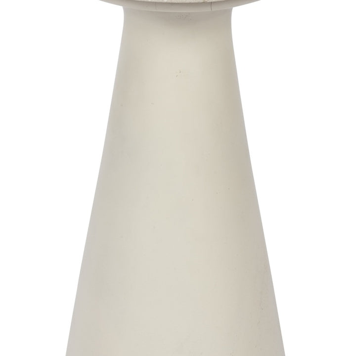 White pedestal base of a round accent side table