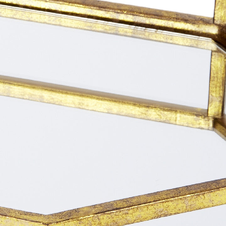 Gold mirrored tray edge close-up with glossy metal trim and glass inserts