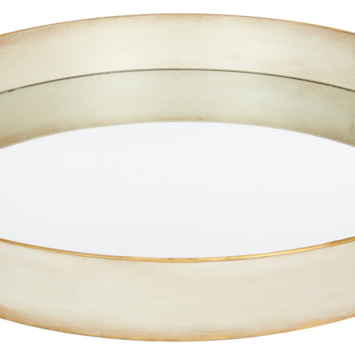 Round metal tray with off-white washed surface and thin brushed gold outer rim