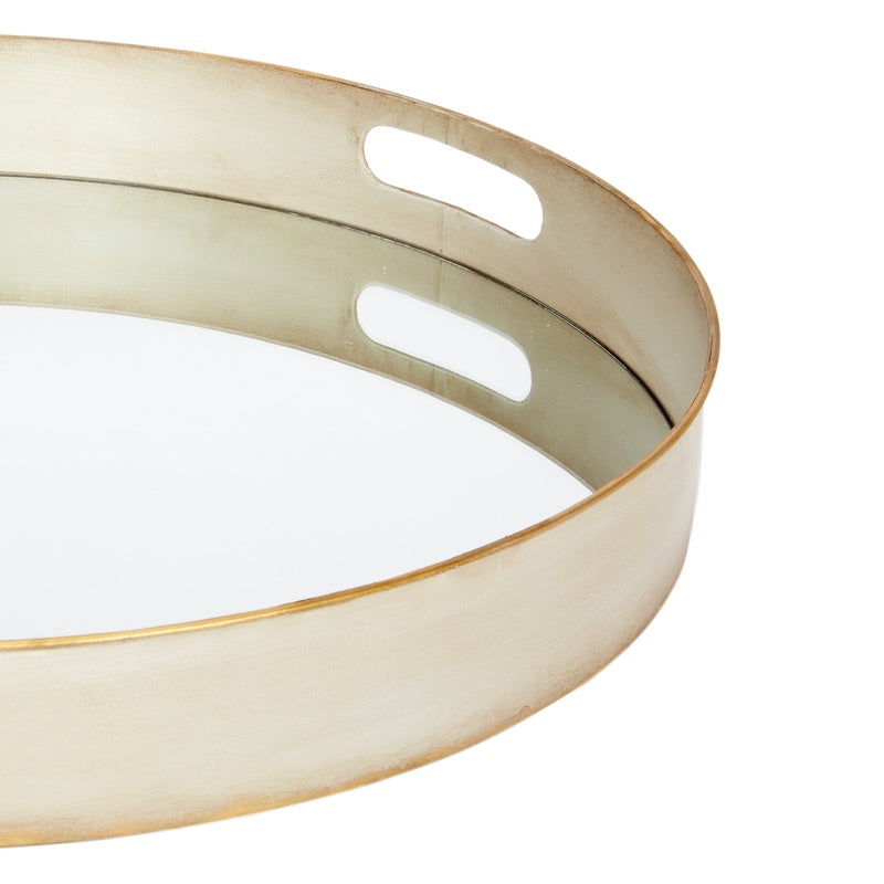Round metal serving tray with two cutout handles and brushed gold rim, off-white finish