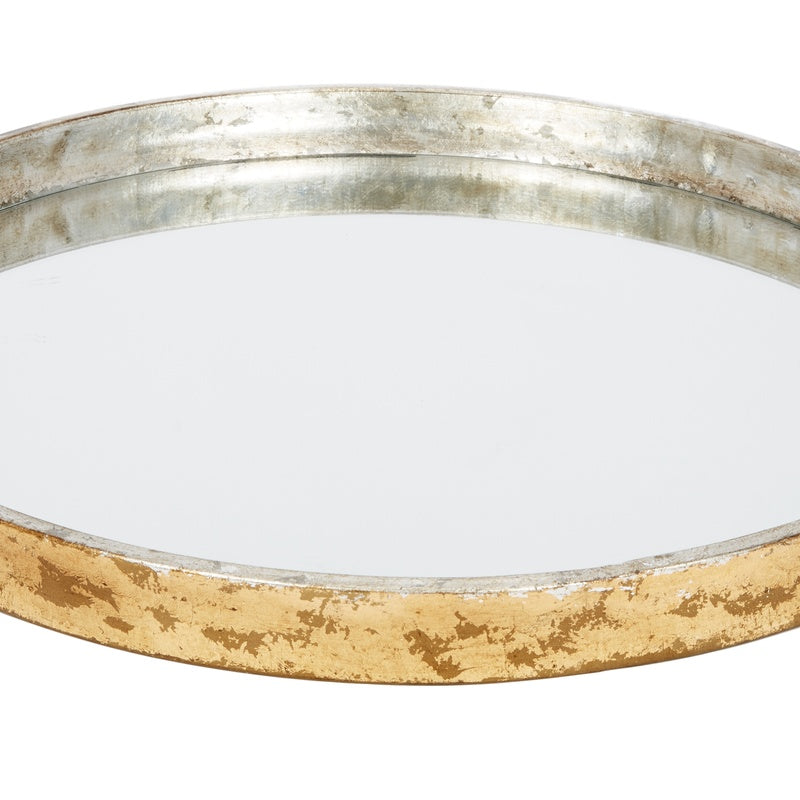 Round mirrored metal tray with silver interior and textured gold outer rim