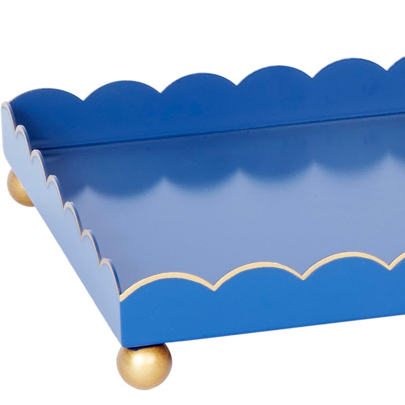 Dark blue rectangular metal tray with gold scalloped trim and corner knob