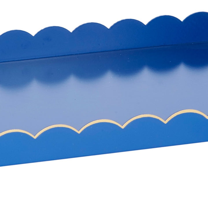 Blue rectangular metal tray with gold scalloped line along the rim