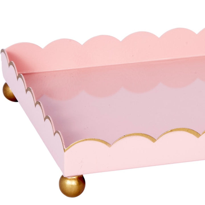 Blush pink rectangular metal tray with gold scalloped border and round gold feet