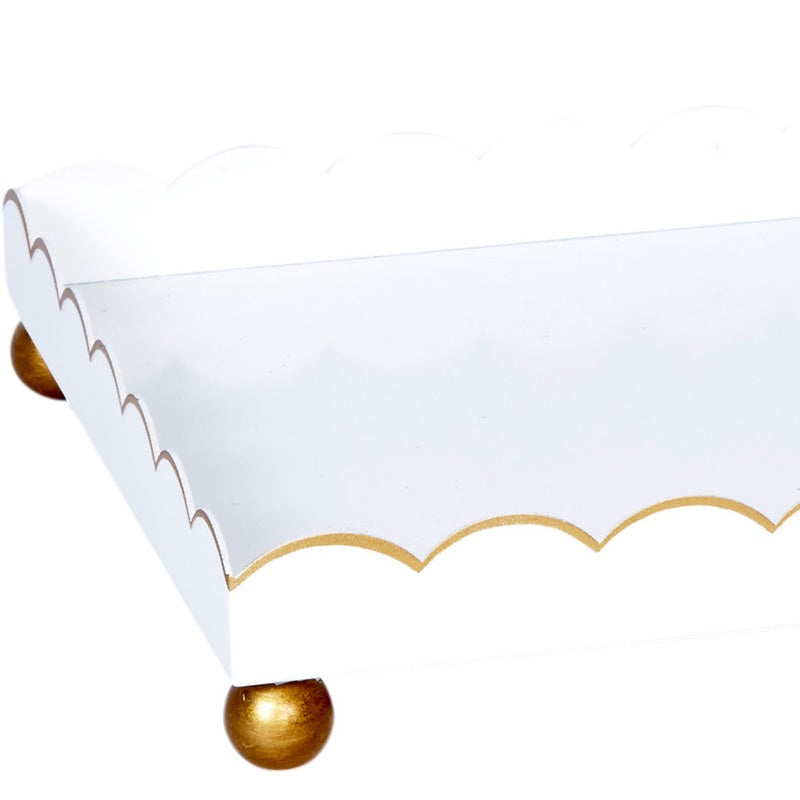 Rectangular white metal tray with scalloped gold trim and rounded gold feet