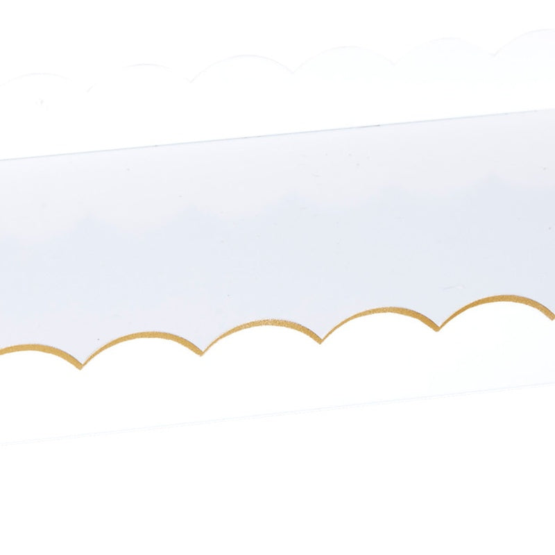 White rectangular metal tray with scalloped gold edge detail