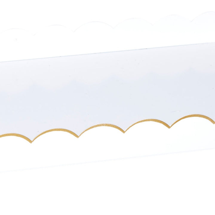 White rectangular metal tray with scalloped gold edge detail