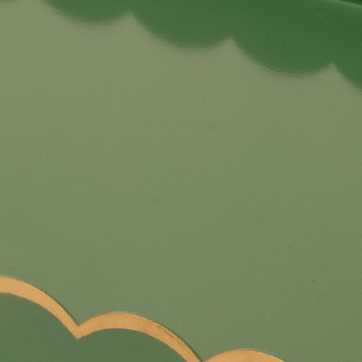 Green tray surface with gold wave trim along the edge.