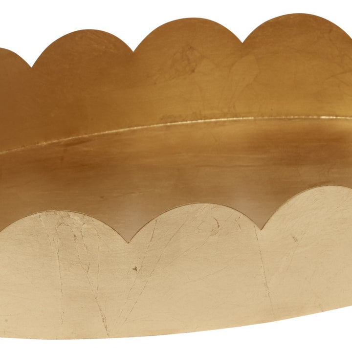 Gold oval tray interior with scalloped rim and subtle leaf texture, wide flat base.
