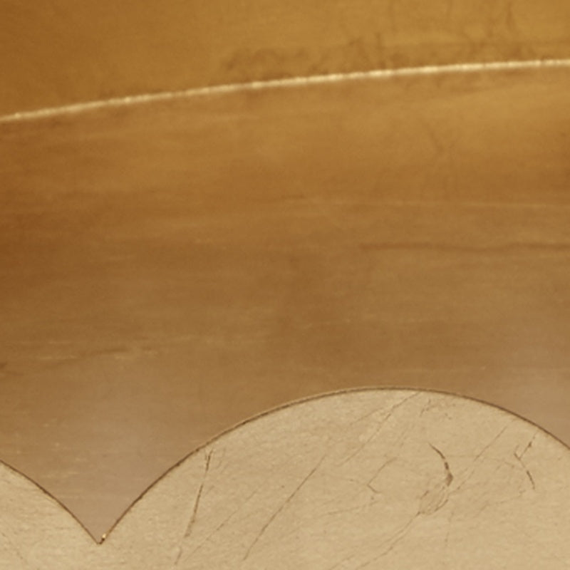 Gold oval tray interior surface with leaf texture and scalloped border detail.