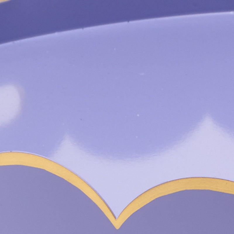 Gold cloud motif on a purple round tray surface