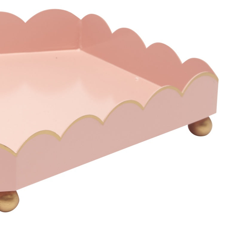 Pink six-sided scalloped metal tray with gold rim and corner gold feet
